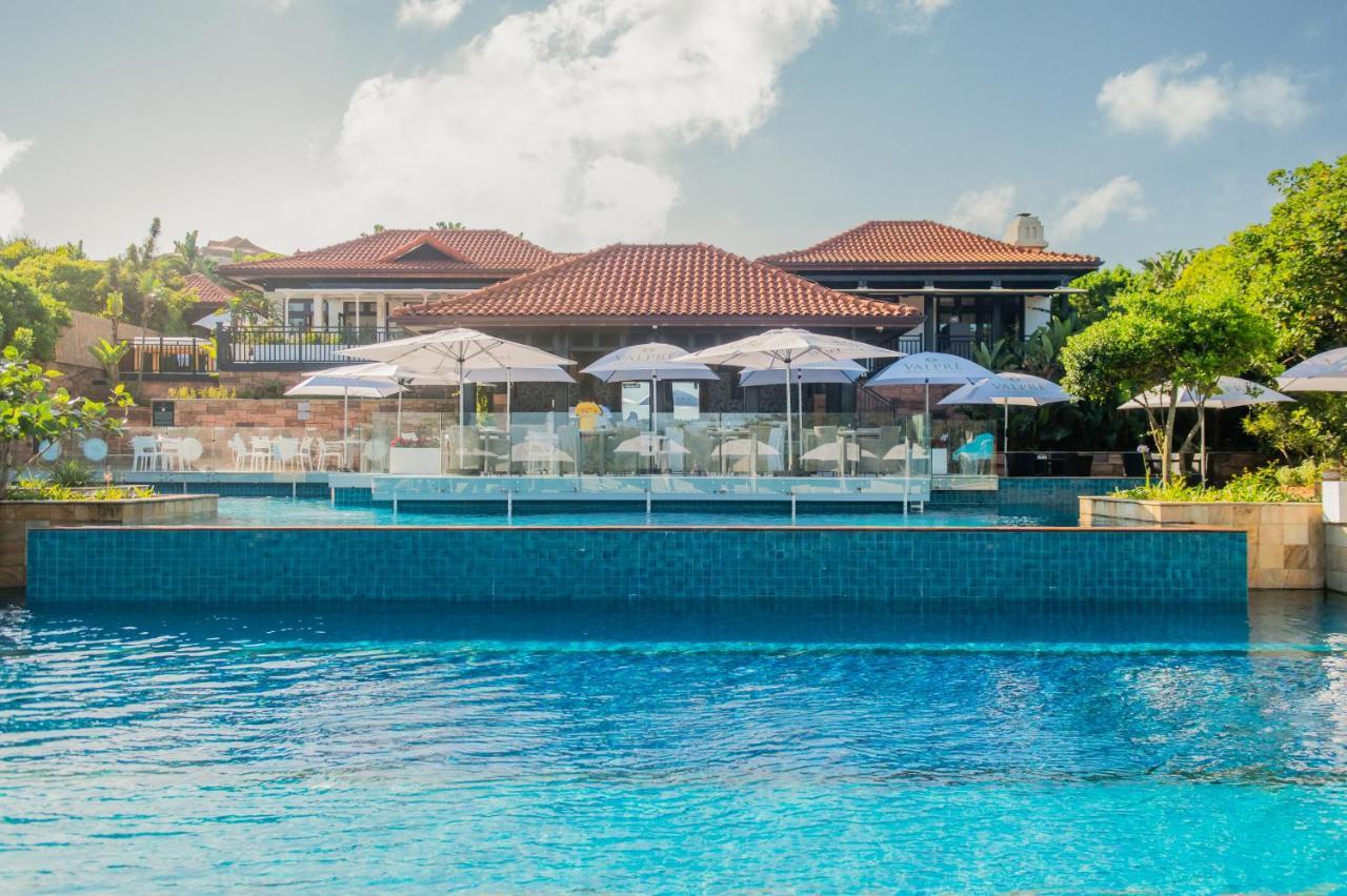 The Capital Zimbali Hotell Ballito Exteriör bild The swimming pool at the resort