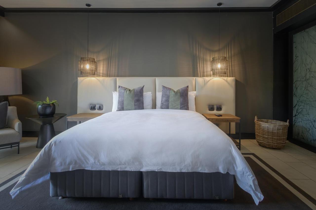 The Capital Zimbali Hotell Ballito Exteriör bild A bedroom at The Ivy Hotel